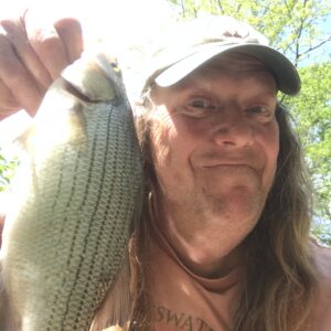 Glasswater Angling co-founder John "Crappie Hippie" King with a nice whtie bass caught on a lead free Jester Jig